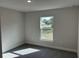 Bright bedroom with carpeted floor and large window at 8005 Tropicaire Blvd, North Port, FL 34291