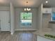 Bright dining area with a chandelier and a window overlooking the backyard at 8005 Tropicaire Blvd, North Port, FL 34291