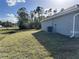 Side view of house showing exterior and landscaping at 8005 Tropicaire Blvd, North Port, FL 34291