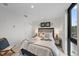 Bright bedroom with a queen-size bed and large window at 1558 4Th St # 216, Sarasota, FL 34236