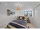 Bedroom with a gold bed frame and large window at 1558 4Th St # 216, Sarasota, FL 34236