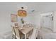 Bright dining room featuring a light wood table and six chairs at 1558 4Th St # 216, Sarasota, FL 34236