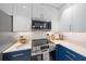 Stainless steel appliances and modern cabinetry in kitchen at 1558 4Th St # 216, Sarasota, FL 34236