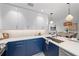 Modern kitchen with white and blue cabinets and island at 1558 4Th St # 216, Sarasota, FL 34236