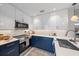 Modern kitchen with blue cabinets and quartz countertops at 1558 4Th St # 216, Sarasota, FL 34236