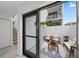 View of private patio from interior, modern design at 1558 4Th St # 216, Sarasota, FL 34236
