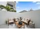 Private patio with seating area and modern design at 1558 4Th St # 216, Sarasota, FL 34236