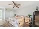 Bright bedroom featuring a king-size bed and ample floor space at 1401 S Mccall Rd # 108A, Englewood, FL 34223