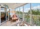 Relaxing screened balcony overlooking lush tropical foliage at 1401 S Mccall Rd # 108A, Englewood, FL 34223