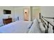 A well-lit bedroom featuring a closet, wood floors, and neutral-colored linens at 221 Evergreen St, Punta Gorda, FL 33982