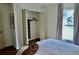 Bright bedroom featuring closet with shelving and a window with natural light at 221 Evergreen St, Punta Gorda, FL 33982