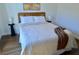 Comfortable bedroom featuring a plush bed, modern lamps, and stylish decor at 221 Evergreen St, Punta Gorda, FL 33982