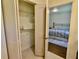This closet features shelving, storage space, and access into the bedroom at 221 Evergreen St, Punta Gorda, FL 33982