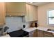 Modern kitchen featuring stylish cabinets, quartz countertops, and stainless steel appliances at 221 Evergreen St, Punta Gorda, FL 33982