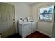 Laundry room features a washer and dryer, and a view to the outside at 221 Evergreen St, Punta Gorda, FL 33982