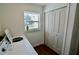 Bright laundry room featuring a modern washing machine and a large window at 221 Evergreen St, Punta Gorda, FL 33982