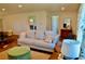 Cozy living room with a comfortable sofa, ottoman and a decorative rug, creating an inviting space at 221 Evergreen St, Punta Gorda, FL 33982