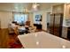 Inviting open-concept living space with modern lighting, sleek countertops, and stainless steel appliances at 221 Evergreen St, Punta Gorda, FL 33982