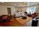 Bright living room featuring a neutral sofa, vibrant rug, and stylish furniture arrangement at 221 Evergreen St, Punta Gorda, FL 33982