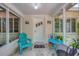 Inviting front porch features stylish seating and a serene atmosphere at 839 40Th St, Sarasota, FL 34234