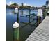 Private dock with boat lift and serene canal views at 5111 Coral Blvd, Bradenton, FL 34210