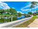 Peaceful waterfront view with lush landscaping and dock at 5111 Coral Blvd, Bradenton, FL 34210