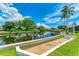 Private canal-front lot with walkway leading to the dock at 5111 Coral Blvd, Bradenton, FL 34210