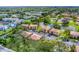 Aerial image of apartment buildings and a tranquil lake in a residential community at 5026 Water Oak Dr # 112, Bradenton, FL 34207