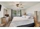 Spacious Primary bedroom with large bed, dresser, and window at 5026 Water Oak Dr # 112, Bradenton, FL 34207