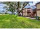 Condo building exterior with wooden staircase and landscaping at 5026 Water Oak Dr # 112, Bradenton, FL 34207