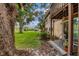 Private patio area with seating and lush landscaping at 5026 Water Oak Dr # 112, Bradenton, FL 34207