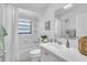 Bright bathroom with bathtub, shower, and vanity at 4740 Marsh Field Rd # 6, Sarasota, FL 34235