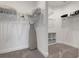 Walk-in closet with white shelving and ample storage space for clothing and accessories at 5709 Puccini St, Nokomis, FL 34275