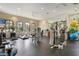 Well-equipped gym featuring modern cardio machines, weight training equipment, and mirrored walls at 5709 Puccini St, Nokomis, FL 34275