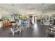 Spacious fitness center offering various workout machines, free weights, and large mirrors for a complete workout at 5709 Puccini St, Nokomis, FL 34275