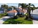 Single-Gathering home with tile roof and a well-maintained lawn at 5116 Brooksbend Cir, Sarasota, FL 34238