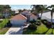 Single-Gathering home with tile roof and landscaped yard at 5116 Brooksbend Cir, Sarasota, FL 34238