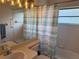 Clean bathroom with shower/tub combo, updated vanity, and a window at 5116 Brooksbend Cir, Sarasota, FL 34238