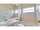 Simple bathroom with a single vanity, shower/tub combo and a large mirror at 5116 Brooksbend Cir, Sarasota, FL 34238