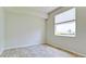 Bright bedroom with tile flooring and large window at 5116 Brooksbend Cir, Sarasota, FL 34238