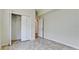 Bedroom with tile floor, double door closet and access to a bathroom at 5116 Brooksbend Cir, Sarasota, FL 34238