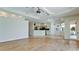 Spacious living area with hardwood flooring and views into the kitchen area at 5116 Brooksbend Cir, Sarasota, FL 34238