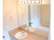 Bathroom with double vanity, mirror, and a bathtub at 1201 Bensbrooke Dr, Wesley Chapel, FL 33543