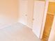 Empty bedroom with carpeted floor and two closets at 1201 Bensbrooke Dr, Wesley Chapel, FL 33543