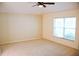 Large bedroom with neutral colored carpet and ceiling fan at 1201 Bensbrooke Dr, Wesley Chapel, FL 33543