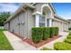 House exterior featuring a well-manicured lawn and walkway at 1201 Bensbrooke Dr, Wesley Chapel, FL 33543