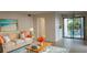 Bright living room with comfy sofa and access to patio at 2232 Bahia Vista St # A2, Sarasota, FL 34239