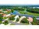 Aerial view of house and neighborhood, showcasing waterfront property at 5919 Sandstone Ave, Sarasota, FL 34243