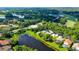 An aerial view of a neighborhood featuring lush landscaping and a community with pools, lakes and golf course at 7217 Churston Ln, University Park, FL 34201