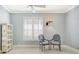 Light and airy bedroom with a ceiling fan, decorative lighting, and a decorative bookcase at 7217 Churston Ln, University Park, FL 34201